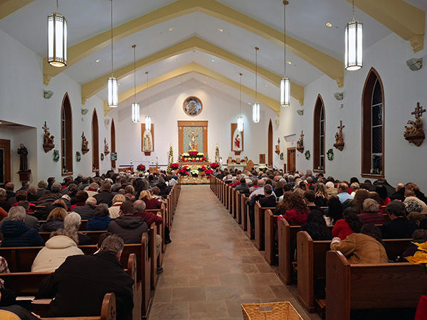 parishioners seated facing towards altar